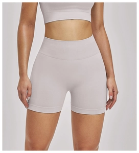 Detail of high-waist seamless yoga shorts in light purple with supportive ribbed waistband