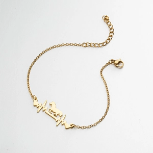 Detailansicht der vergoldeten Edelstahl-Armband mit Herzschlag- und Pferdemotiv-Anhänger