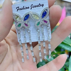 Handheld silver butterfly earrings with long fringe and multi-colored cubic zirconia crystals