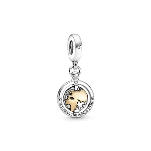 Silver globe pendant with gold detailing and 'You mean the world to me' engraving