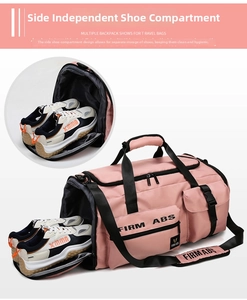 Detail view of the pink travel bag featuring an independent side shoe compartment