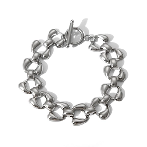 Detail of silver stainless steel chain bracelet with a unique OT toggle clasp design