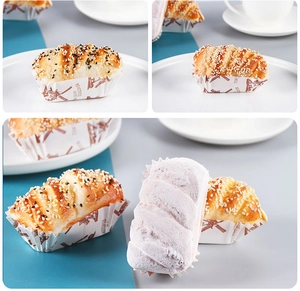 Detail of greaseproof baking paper cups with brown windmill patterns and text for cakes
