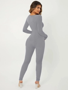 Detail shot of grey ribbed knit long sleeve bodysuit showing slim fit texture and seams