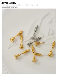 Close-up of gold and silver screw stud earrings displayed on a white ceramic plate