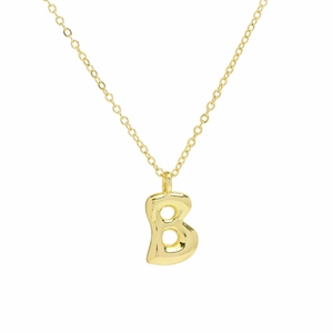 Detailed view of polished gold 18k balloon-style letter B pendant on a fine chain necklace