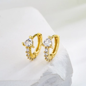 Gold plated huggie hoop earrings with mini zircons and triangle stone on white stone