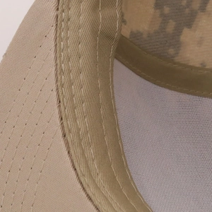 Detail shot of the beige cotton cap interior showing reinforced sweatband and camo lining