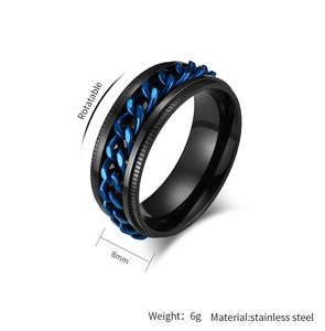 Macro view of 8mm black stainless steel ring with rotatable blue gear chain inlay