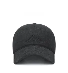 Detailed close-up of charcoal grey winter baseball cap with black mountain embroidery
