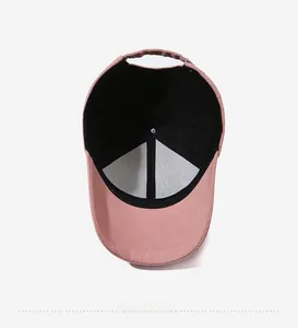 Internal view of the pink baseball cap showing the breathable mesh lining and stitching