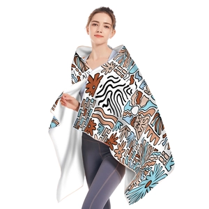 Detail of soft microfiber beach towel with sun shine print and delicate hemmed edges
