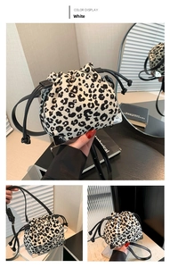 Detailed views of leopard print bucket bag with drawstring closure and silver corner guards