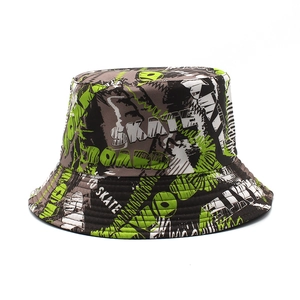Detail of street style bucket hat featuring graffiti canvas and skate board print