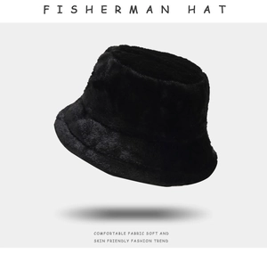 Detail shot of black plush fisherman hat showing soft fuzzy texture and warm winter material