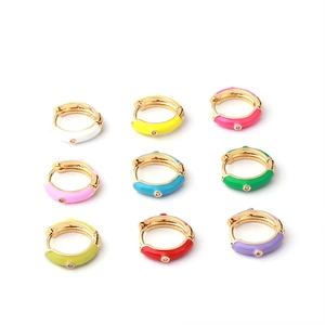Set of 9 colorful enamel huggie hoop earrings in gold with small sparkling rhinestones