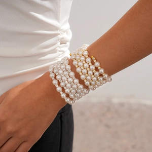 Detail of layered baroque pearl bracelet with rhinestone spacers in gold and silver