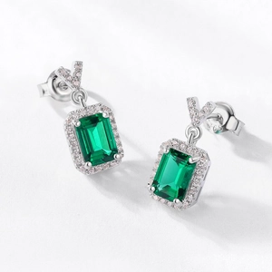 Elegant S925 silver stud earrings with rectangle cut emerald green stone and pavé halo