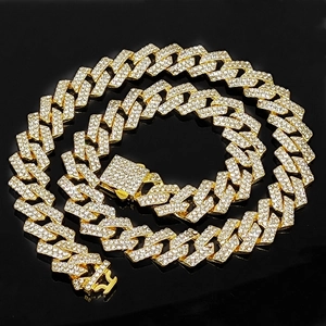 Macro shot of 15mm gold iced-out Cuban chain with diamond encrusted spring clasp