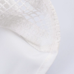 White French-style blouse featuring romantic floral embroidery and intricate mesh texture