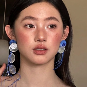 Exaggerated French style blue woven fringe earrings with white shells for a bohemian look