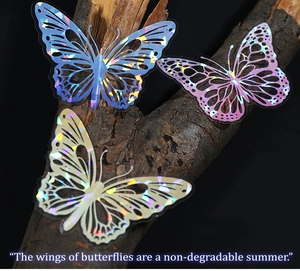 Macro detail of laser holographic butterfly stickers on tree bark background