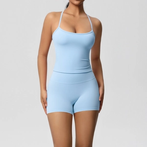 Front view of light blue ribbed sports set featuring cross-back camisole and biker shorts