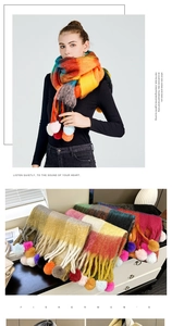 Detailed view of colorful plaid winter scarf with rainbow tassels and soft texture