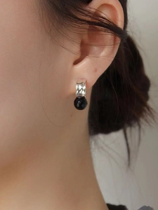 925 Sterling silver French vintage earrings with faceted black beads on a model
