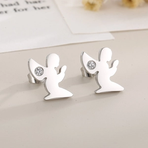 Macro shot of silver angel wing stud earrings with sparkling round cubic zirconia stones