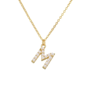 Detail of elegant gold letter M pendant necklace with fine pearl inlay craftsmanship