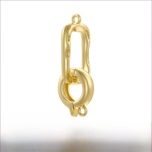 Macro detail of 18K gold plated brass oval clasp connector for jewelry 11x28mm