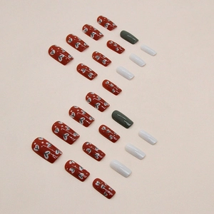 Vintage red and green floral press-on nails with white heart patterns and square tips