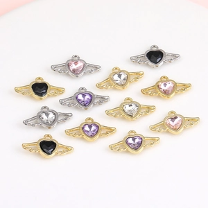 DIY heart wing charms with colorful faux gemstones in gold and silver plating