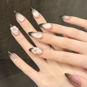 Handmade 3D flower press-on nails with black gradient cat-eye effect and rhinestones