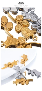 Makro-Detail von Rosenblüten-Anhängern in Gold und Silber für DIY-Schmuckherstellung
