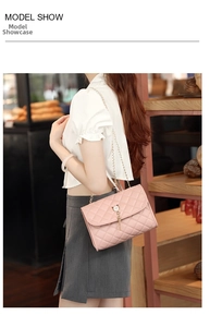 Sweet pink quilted crossbody bag with cat-ear buckle and gold tassel on model