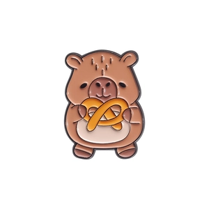 Cute cartoon capybara enamel pin holding a pretzel, adorable animal badge for clothing