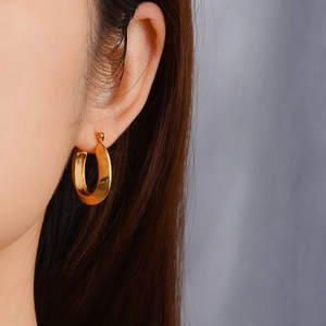 Minimalist golden titanium geometric hoop earrings for women with high-gloss finish