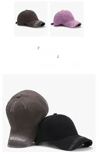 Detail of washed cotton baseball caps in dark grey and purple with ONEDAY embroidery