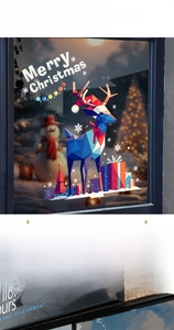 Detailed view of blue geometric reindeer and Merry Christmas stickers on glass window