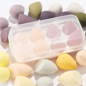 Macro shot of multi-colored makeup sponges in a clear 8-slot storage container