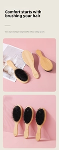 Close-up of natural bamboo handle with high-density black boar bristle hairbrush detail