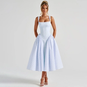 Detailed view of the plaid pattern and backless design on the blue checkered sun dress