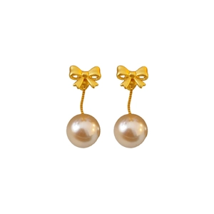 Elegant matte gold bow earrings with round white pearls on a clean white background