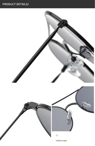 Detail view of double bridge metal aviator sunglasses with gray lenses and black frames