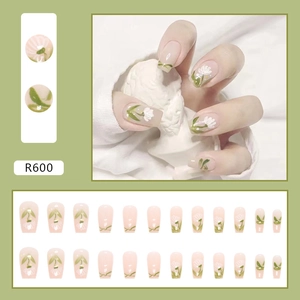 Detail of 24pcs nude pink press-on nails with green floral patterns and R600 model code