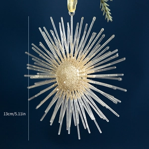 Detail of a 13cm champagne gold glitter explosion star ornament with radial acrylic spikes