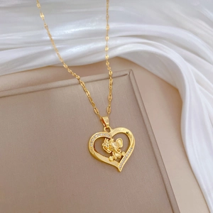 Elegant gold heart necklace with elephant pendant and sparkling zircons for women