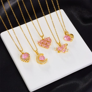 Pink heart pendant necklaces with bow and flower designs in gold-plated stainless steel